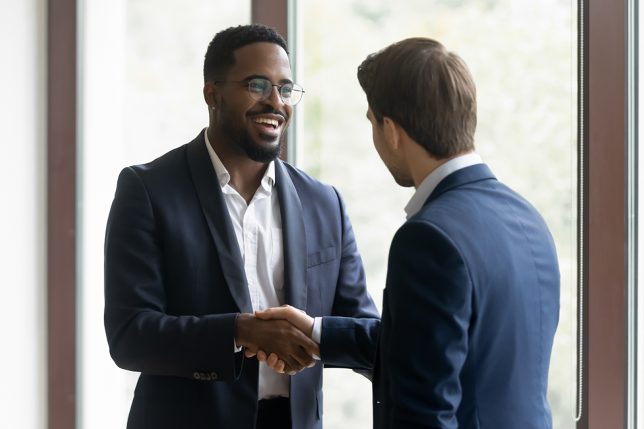 2 men shaking hands