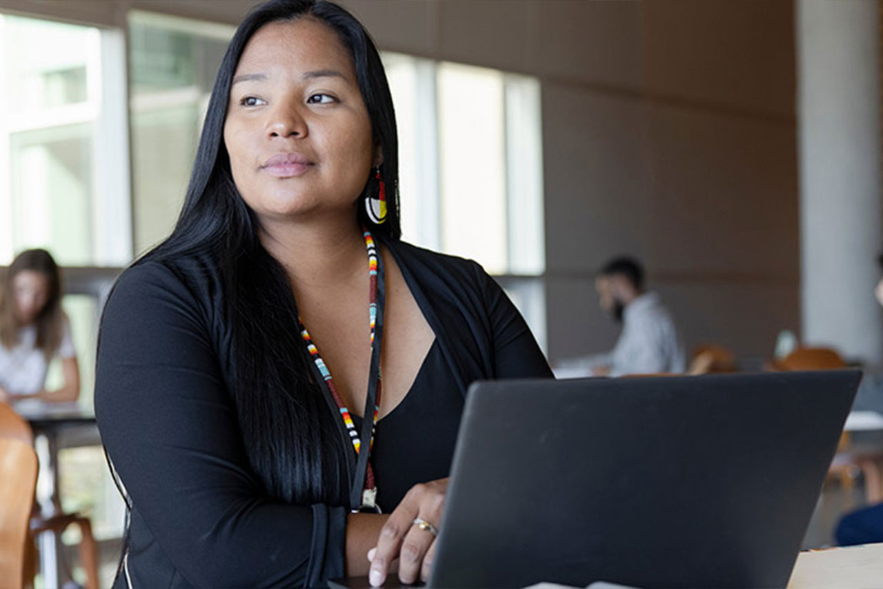 a woman behind her computer